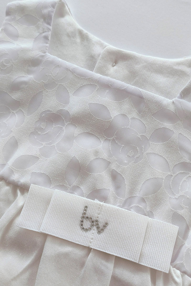 Pagliaccetto in tela di cotone con inserto tessuto devorè, nastro in gros grain e strass