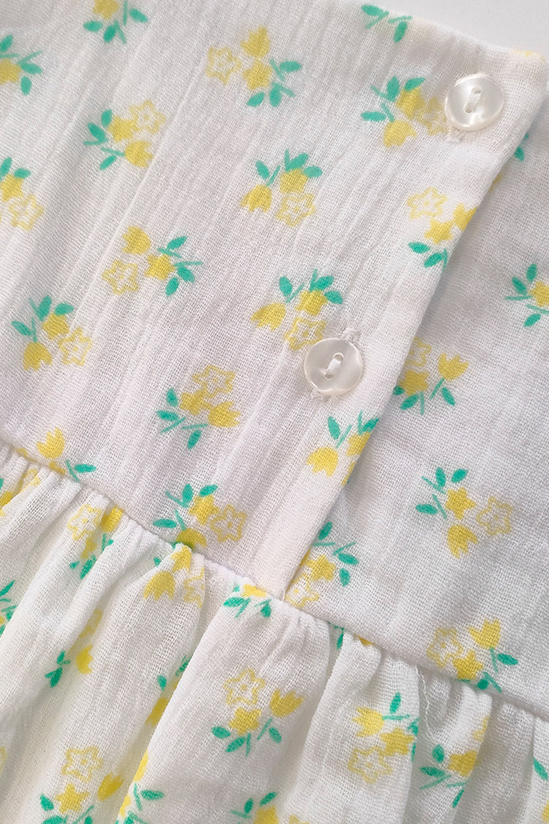 Vestitino in mussola 100% cotone fantasia floreale con taglio, arricciatura e abbottonatura sul davanti