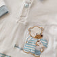 Tutina in cotone elasticizzato con inserti rigati e ricamo