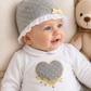 Cappellino in ciniglia a pois con rouches e nodino in velluto