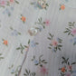 Completo 2 pezzi: Camicia in mussola di cotone fantasia provenzale con colletto, piega, bottoncini in madreperla e maniche a sbuffo + leggings in jersey elasticizzato con rouche al fondo fantasia