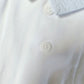 Body a camicia in jersey elasticizzato con colletto in tela di cotone goffrata millerighe con bottoni e pieghette