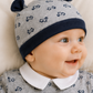 Cappellino in felpa garzata fantasia scooter