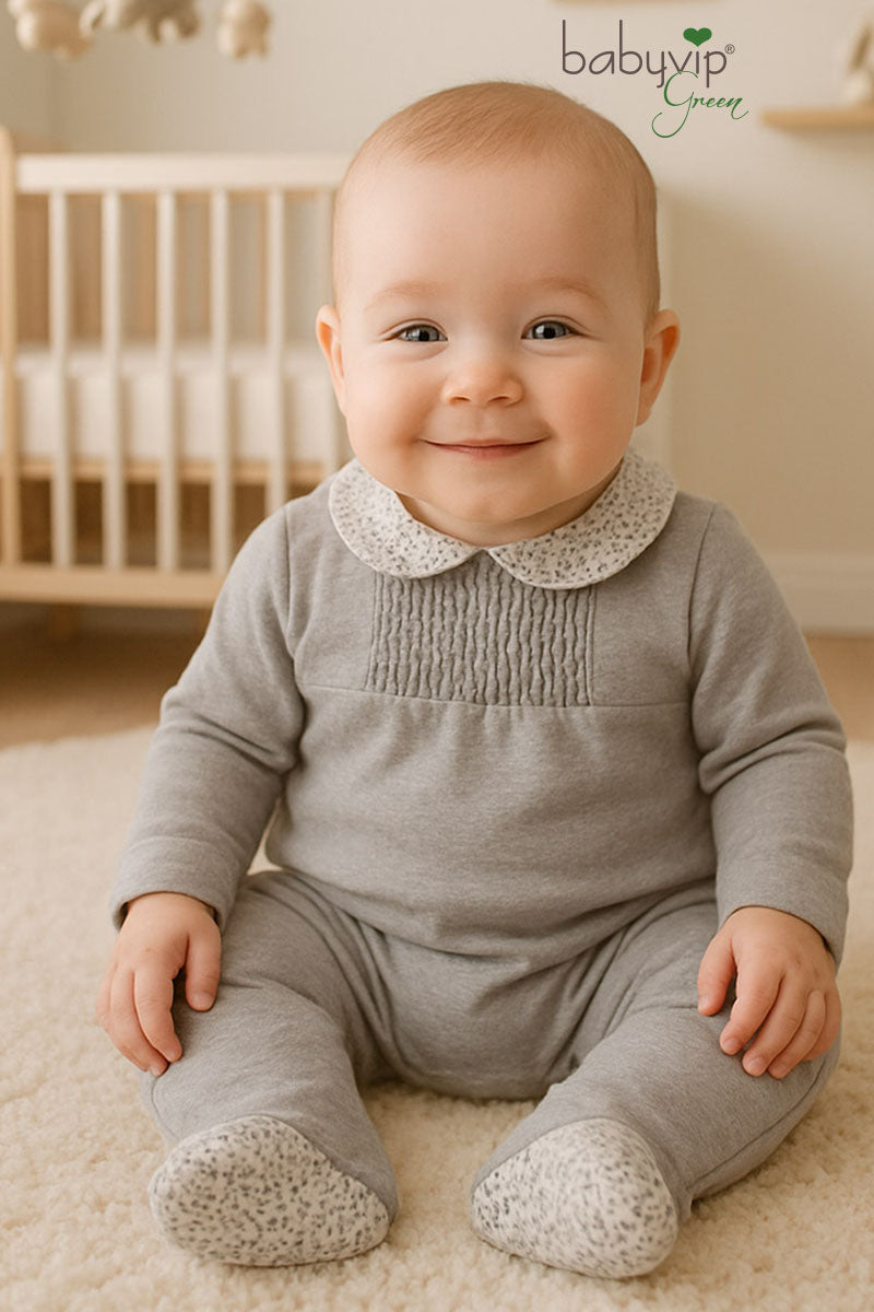 Tutina in caldo cotone organico con colletto fantasia floreale e taglio con punto smock