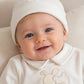 Cappellino neonato in ciniglia con risvolto