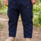 Pantalone modello cavallo basso in lino con tasche e risvolti sul fondo