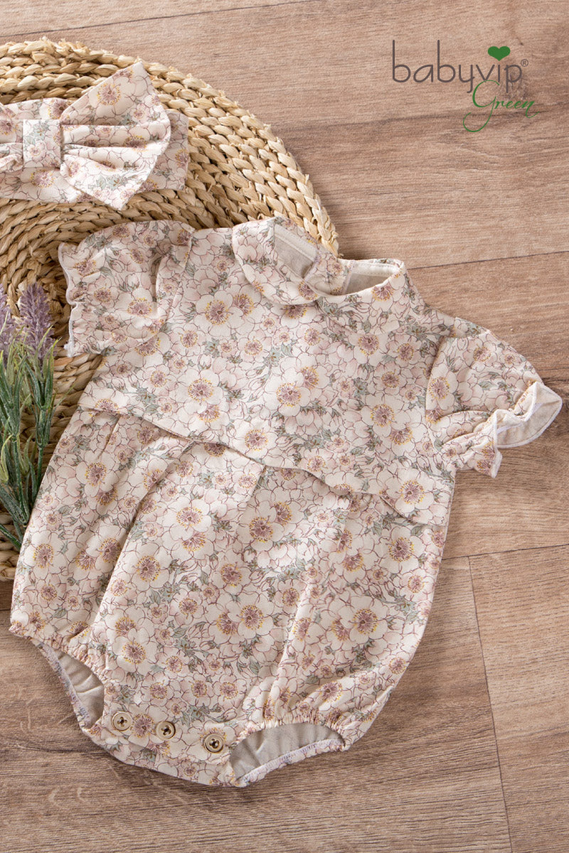 Pagliaccetto neonata in tela di cotone organico con colletto e maniche a palloncino